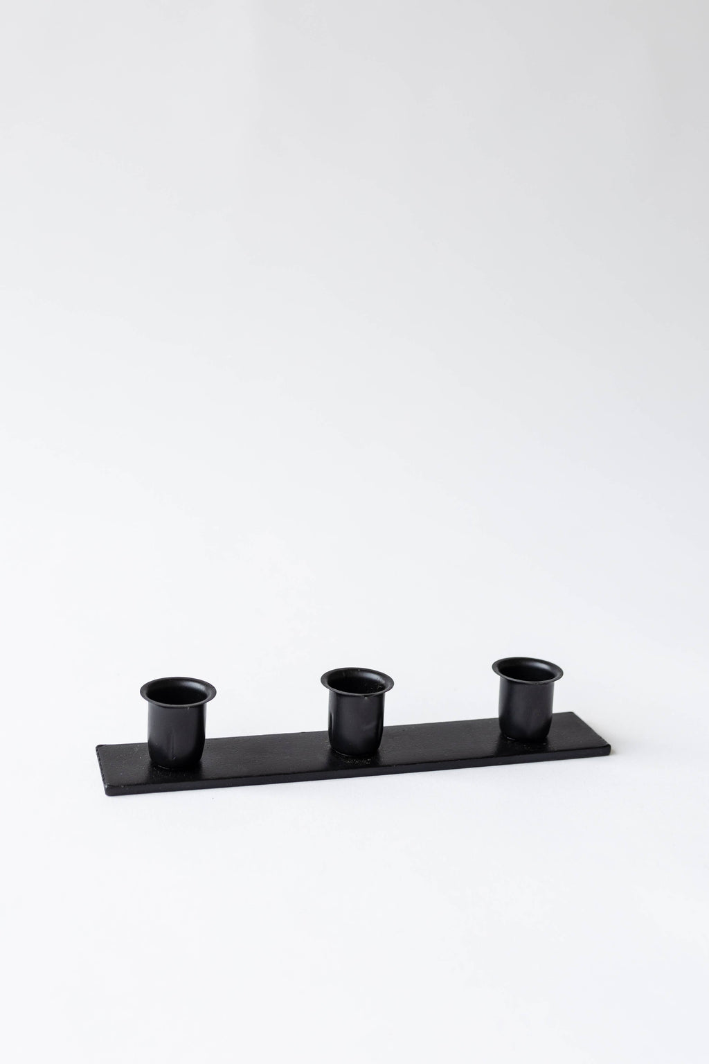 The Triple Candlestick Holder