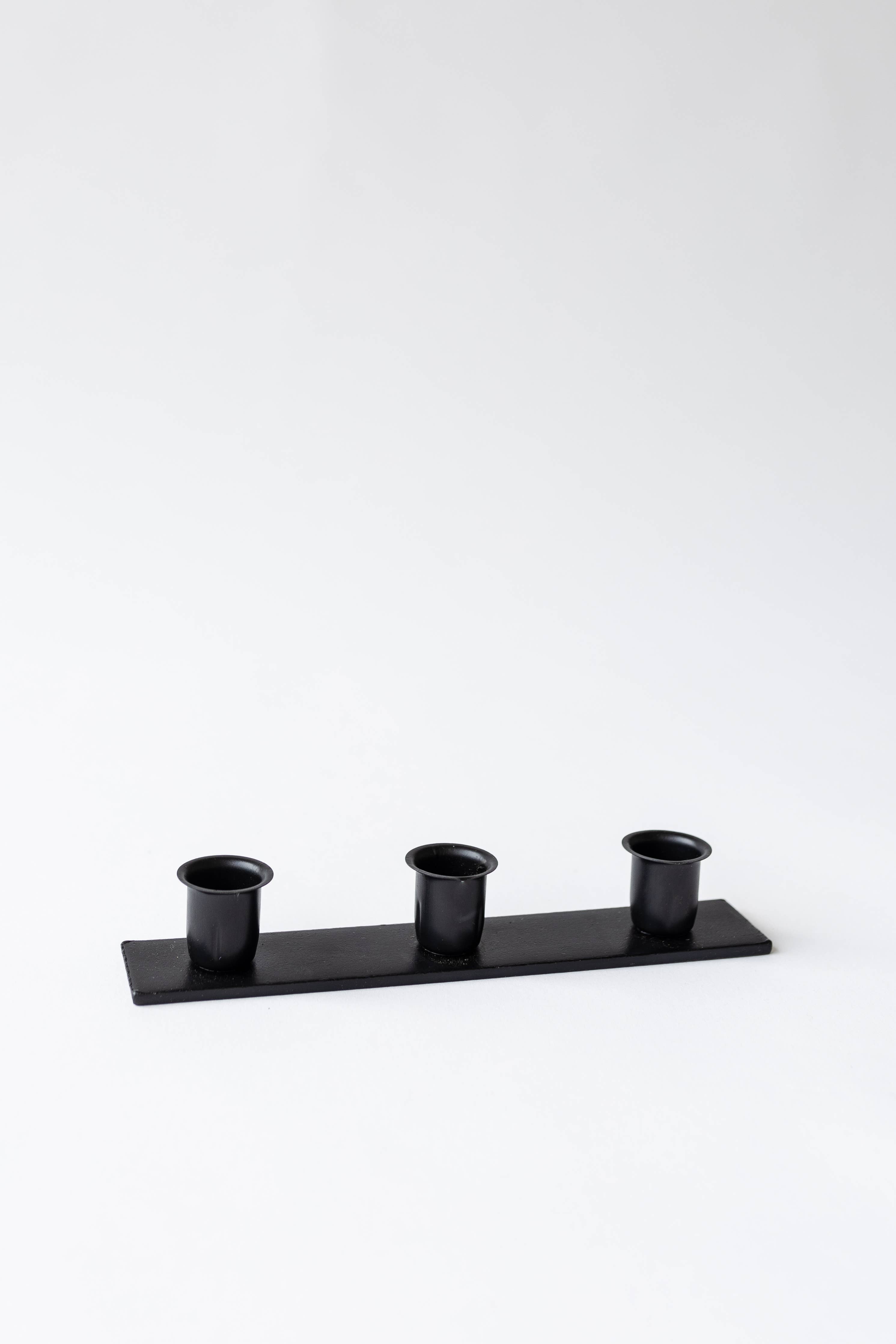 The Triple Candlestick Holder