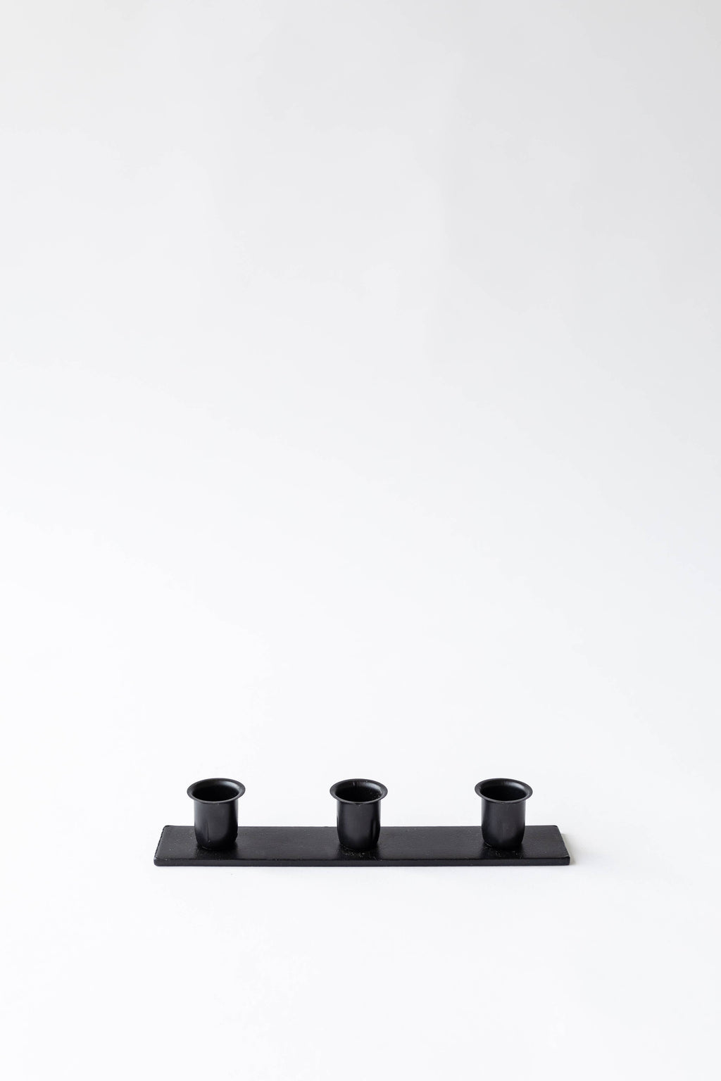 The Triple Candlestick Holder